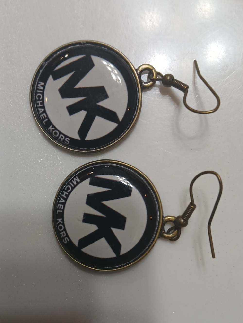 Michael Kors round logo dangle earrings feature the brand's iconic "MK" monogram - Picture 6 of 8
